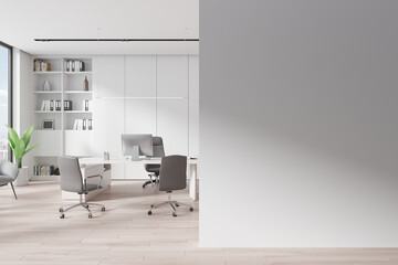 Cozy work interior with armchair and desk, shelf and window. Mockup wall