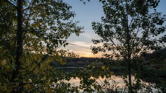 Autumn twilight near a forest lake, beautiful autumn landscape, camera movement, hyperlapse 4k video 4096 2304