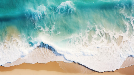 An aerial view captures crashing waves along the shoreline of a tropical beach, offering an abstract perspective of the ocean's dynamic surf