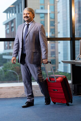 Fototapeta na wymiar Photo of a senior businessman at an airport.