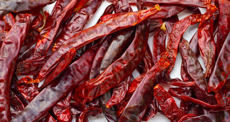 Dried red chili pepper  on white background. - obrazy, fototapety, plakaty