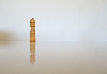 a pepper shaker made of wood