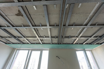 The metal frame of the ceiling, sound insulation, in the process of repairing an apartment