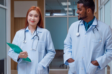 doctor portrait female and male doctors standing in the hospital corridor