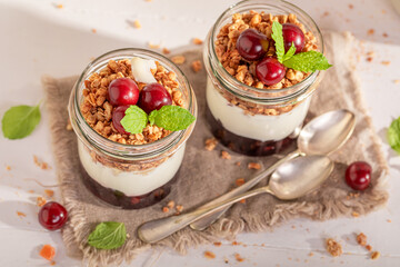 Delicious and homemade cherries granola in summer kitchen for lunch.