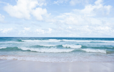 Beautiful tropical sand on beach and blue sky with white clouds, Soft Wave Of Blue Ocean On Sandy Beach, summer vacation and holiday concept.