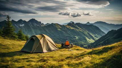 Beautiful summer landscape with mountains, with a tourist tent in the foreground on a sunny day.