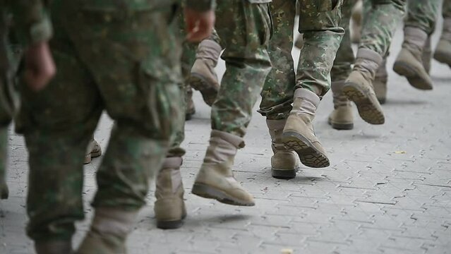 Soldiers in marching formation during military recruitment 