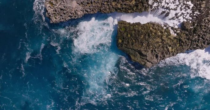Waterblow Nusa Dua top aerial view. Footage of beautiful powerful waves of the Indian Ocean, beautifully crashing against the rocks. Bali, Indonesia.