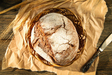 Freshly baked traditional bread on a wooden table.