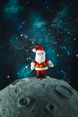 Plasticine Santa Claus on the moon. Christmas card.