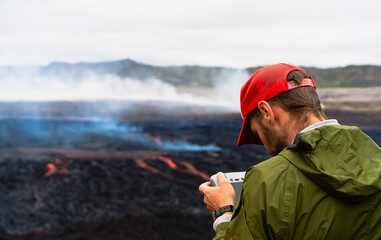 Traveler with drone create photo and video in Iceland near volcano in 2023. Lava flow. Icelandic...
