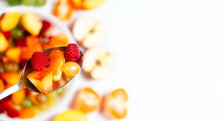 Healthy dessert fruit salad, banner with space for text on white.