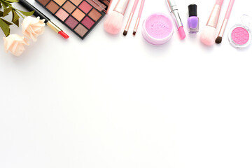 Various cosmetics and makeup tools are left blank on a white background - obrazy, fototapety, plakaty