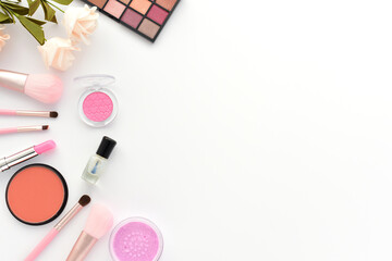 Various cosmetics and makeup tools are left blank on a white background