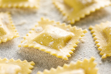 Cooking ravioli on a floured kitchen table