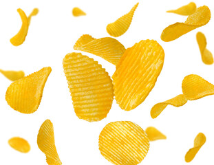 Ridged potato chips isolated on white fly and levitate in space. Selective focus