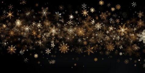 Gold and white snowflakes on a black background in defocus. Abstract bokeh backdrop. New year and...