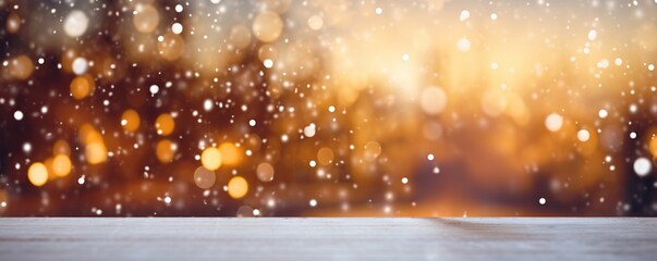 A wooden table on a yellow background of lights and snowfall in defocus. Abstract bokeh backdrop....