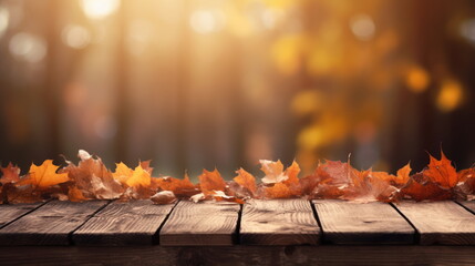 Naklejka na ściany i meble Wooden table with autumn leaves background