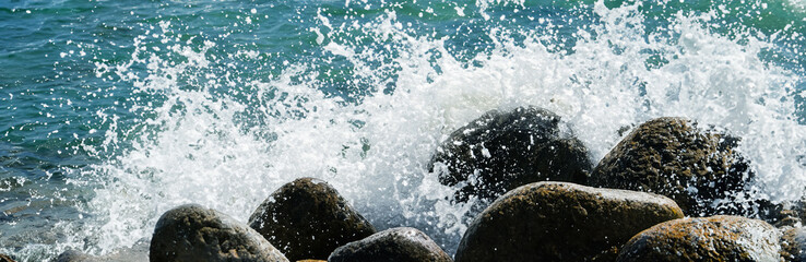 Sea water hits rocks on the beach By the sea with strong waves