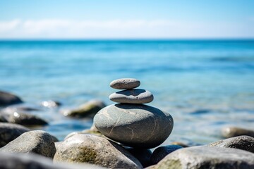 stacks of zen stone pebbles with ocean background 