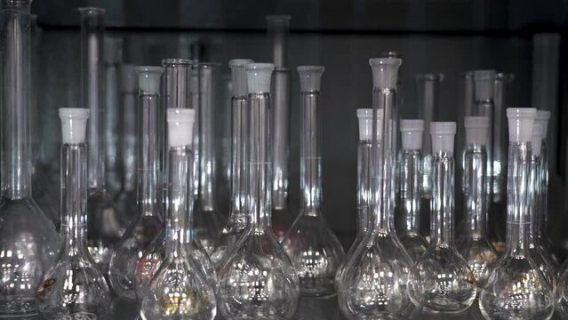 Empty glass flasks. A lot of flasks with lids