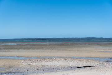 Low tide view from Tinnanbar, across the Great Sandy Strait to Fraser Island (K’gari). Queensland, Australia.
