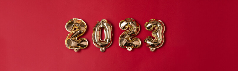 Gilded Beginnings: Embracing 2023 with Golden Foil Numbers on Red