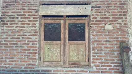 classic window in the middle of a brick wall