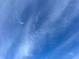 Blue sky with fluffy clouds, natural heavens background