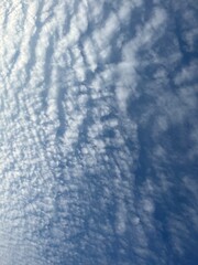Blue sky with fluffy clouds, natural heavens background