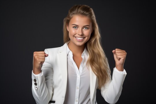 Image of pretty cheerful business woman standing isolated over white background showing thumbs up. Looking camera.