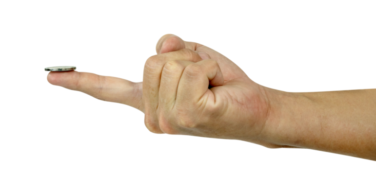 Coin on the finger isolated