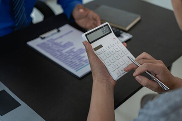 Car loan with calculator Explain in detail to customers the terms and conditions in the distributor office. Provide financial and insurance services Close-up pictures