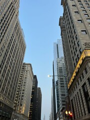 Fototapeta premium Low angle view of buildings in Chicago against sky at dusk