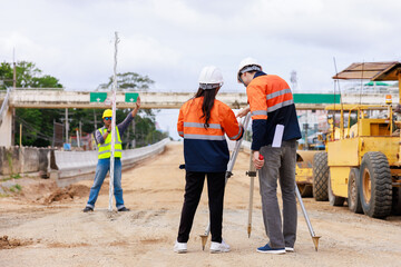 Engineer use theodolite equipment for route surveying to build a bridge