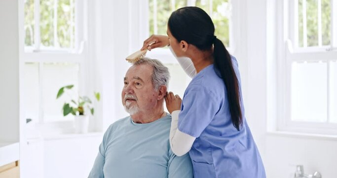 Brush, hair and senior man with caregiver grooming, routine and helping a person with a disability in nursing home. Elderly care, nurse and brushing, haircare or help in retirement, bathroom or house