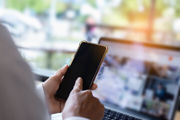 Pretty young hipster woman sitting in a cafe with her laptop, lo