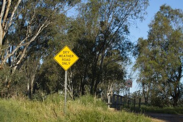 Dry Weather on Road Sign on a rural dirt road in Australia	
