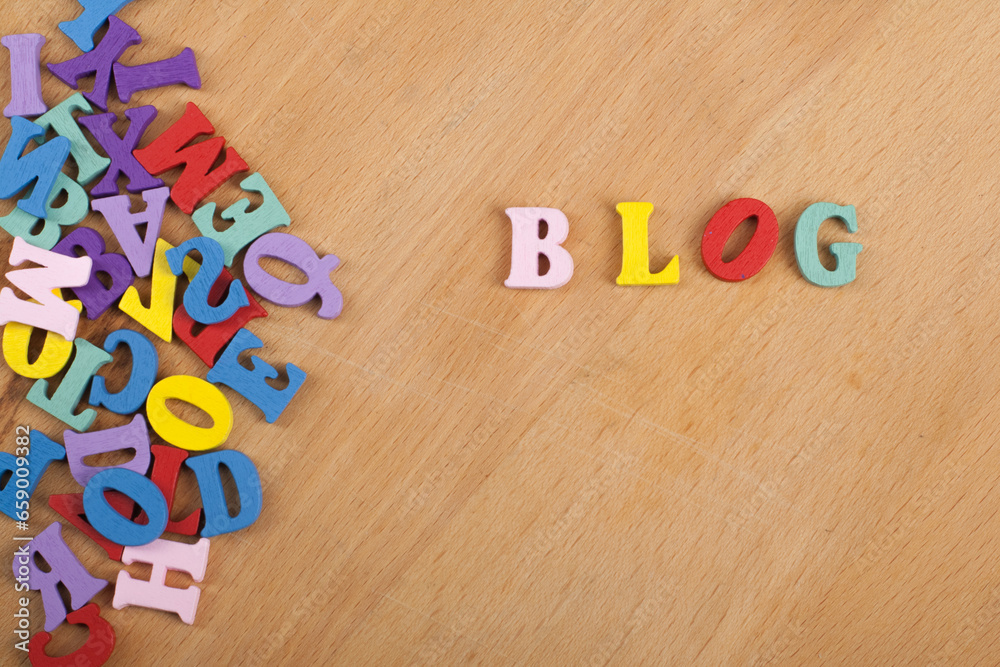 Fototapete blog word on wooden background composed from colorful abc alphabet block wooden letters, copy space 