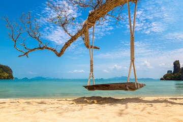 Empty swing at tropical beach - obrazy, fototapety, plakaty