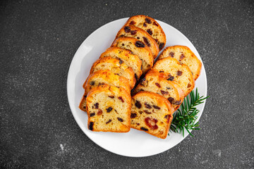 fruit cake pastry dried fruits cherries, dried apricots, prunes, raisins sweet Christmas sweet dessert holiday treat new year and christmas meal food snack on the table copy space food background