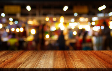 Empty wooden table with bokeh and blur restaurant background, for your photo montage or product...