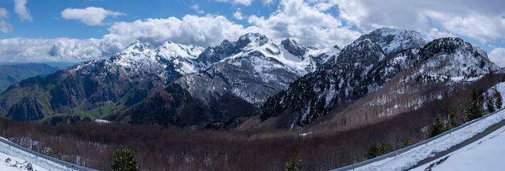Beautiful huge landscape panorama of mountains during winter, full of winter and ice in a sunny day in Valbona national park, shkoder, albania - obrazy, fototapety, plakaty