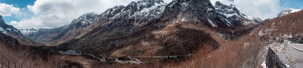 Beautiful huge panorama of landscape with road crossing mountains with ice and snow in Valbona national Park, shkoder, albania