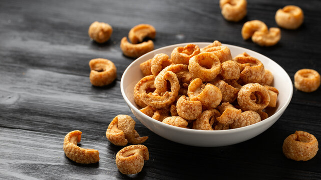 Crispy Pork crackling, scratchings. deep fries in white bowl