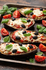Healthy Eggplant or Aubergine pizza with tomato sauce, mozzarella cheese, basil and olives