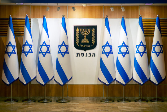 Jerusalem, Israel - 12 29 2022: Flags of Israel and coat of arms in the lobby of Israeli Parliament (Knesset). Support Israel! Save Isreal!