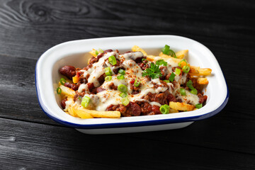 Chili Cheese Potato Fries topped with hot minced beef and cheese sauce